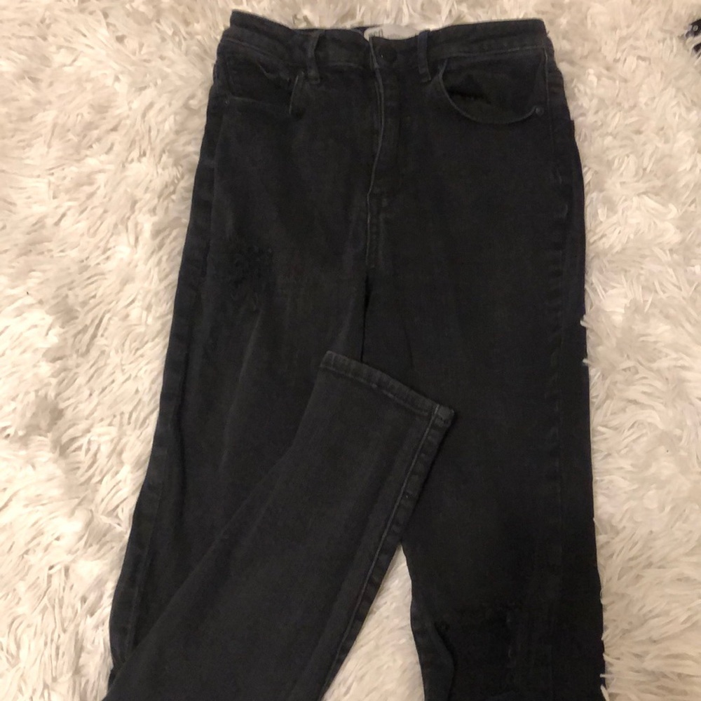 Ripped jeans, near pocket and on knee